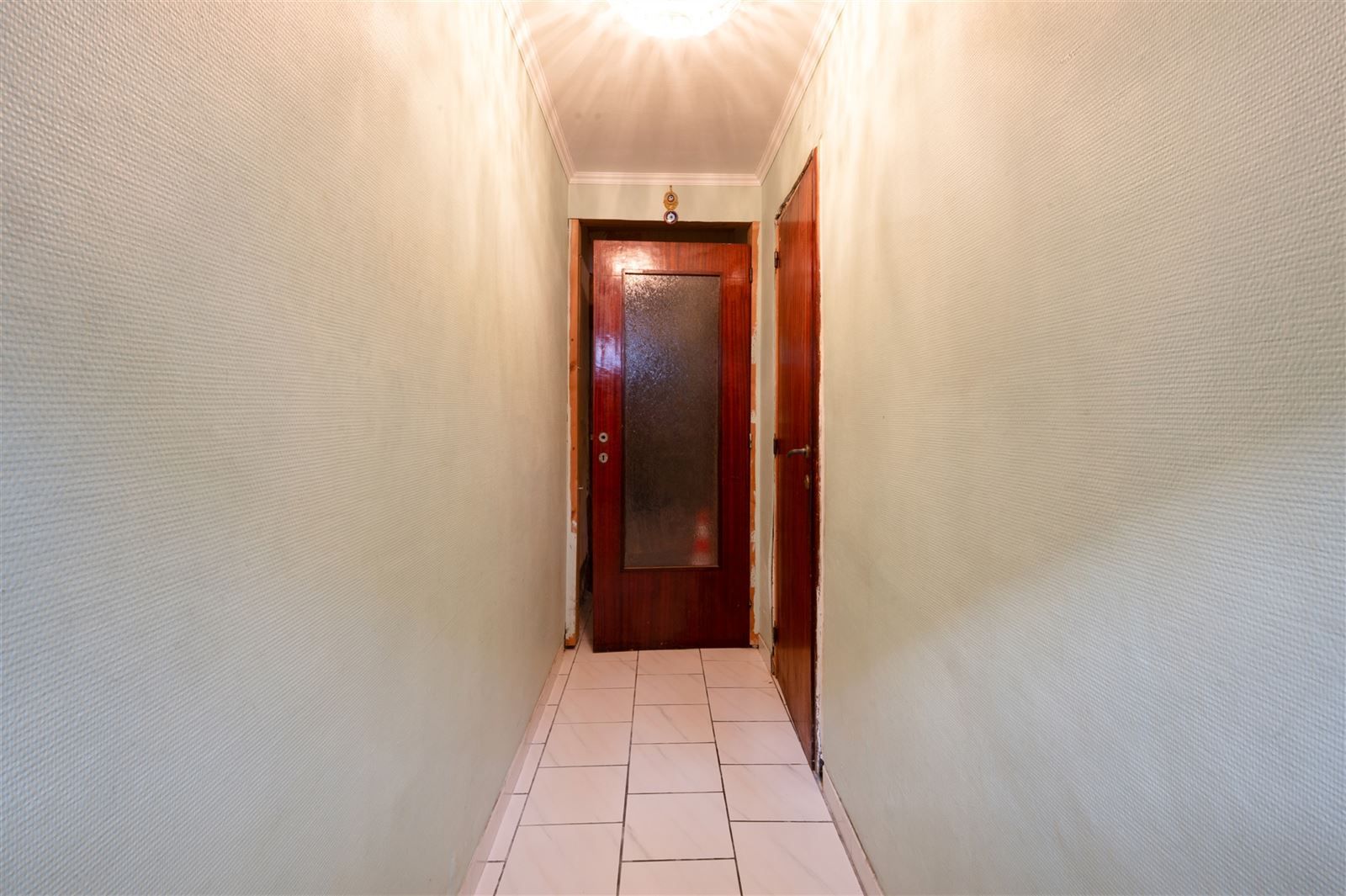 Deels te renoveren stadswoning met tuin op 1are19 foto 8