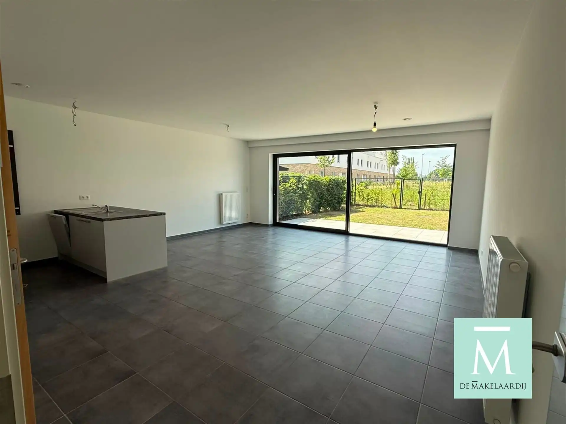 Nieuwbouwappartement met 2 slaapkamers en tuin! foto {{pictureIndex}}