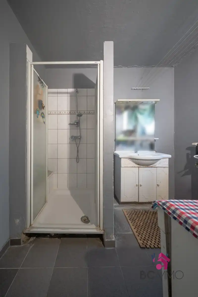 Halfopen bebouwing met twee woongedeeltes (125 m² + 95 m²) en tuin. foto 7