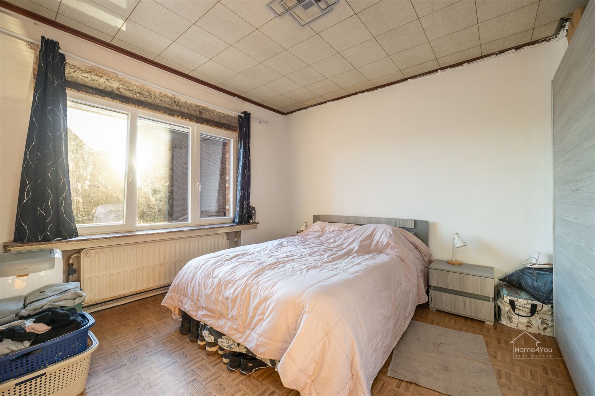Op te frissen woning met zéér ruime extra zolder foto 10