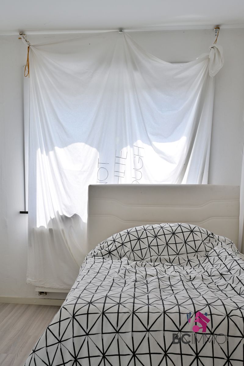 Handelswoonst met een triplex appartement te koop in Genk foto 9