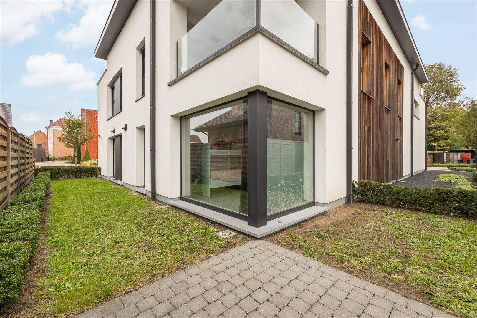 Lichtrijk gelijkvloersappartement met zuid tuin en garage. foto 16