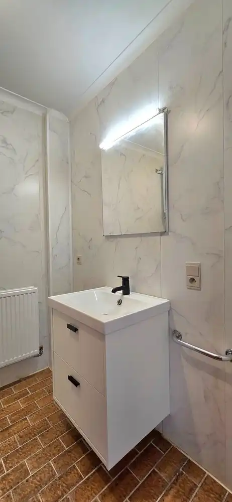 Instapklaar 2-slaapkamer appartement met garage, autostaanplaats en kelderberging foto 14