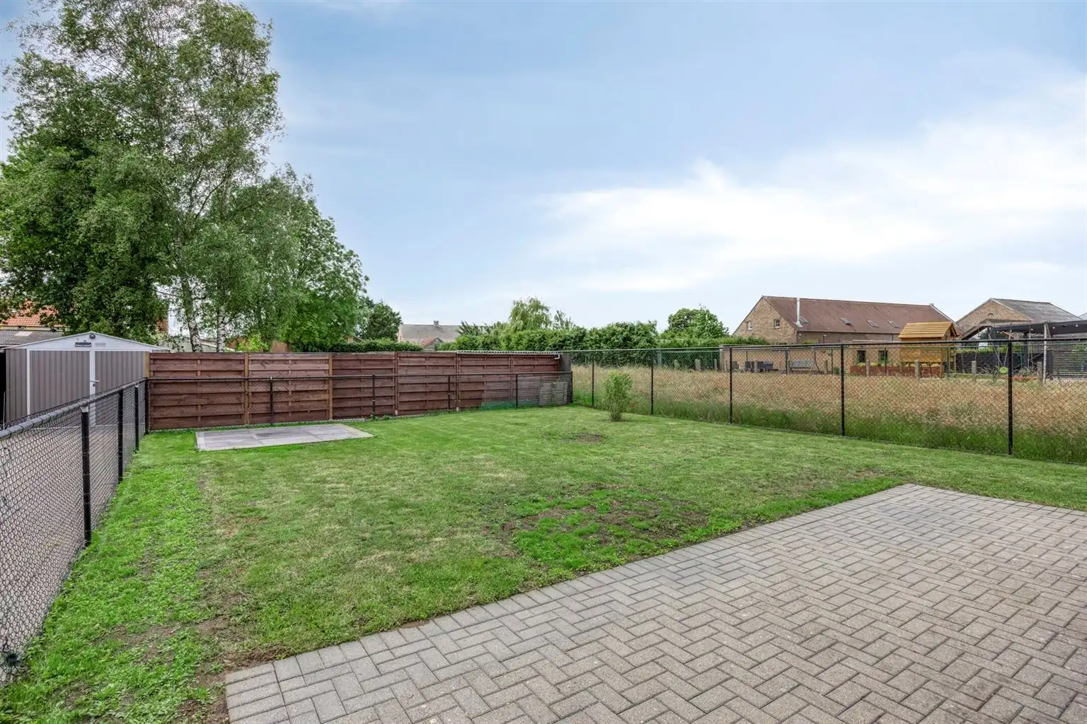 Instapklaar gelijkvloers appartement met 2 slaapkamers, ruime tuin en parkeergelegenheid op een rustige toplocatie in Opitter.  foto 10