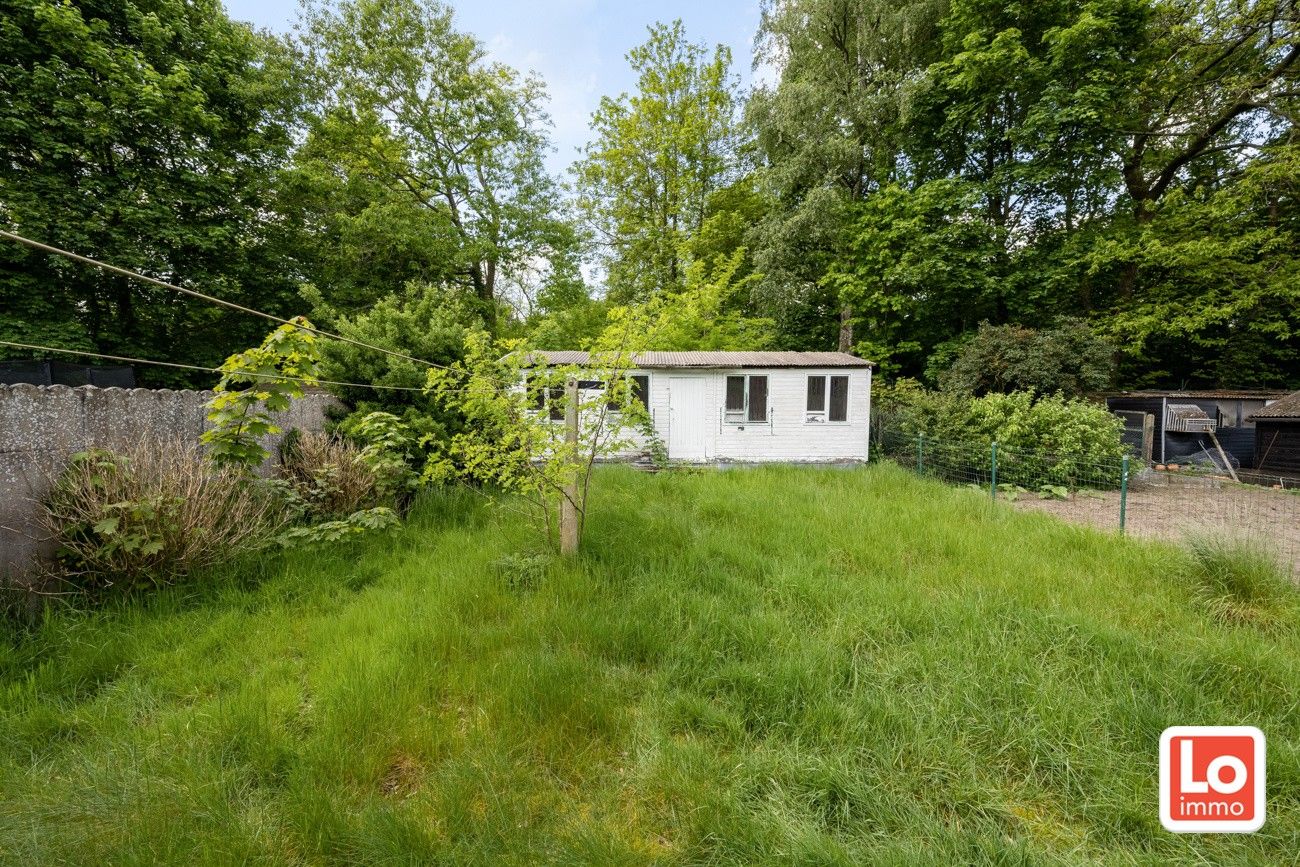 Halfopen woning met afzonderlijke garage en bijgebouw op toplocatie aan de groen long 'De Kollebloem'! foto 19