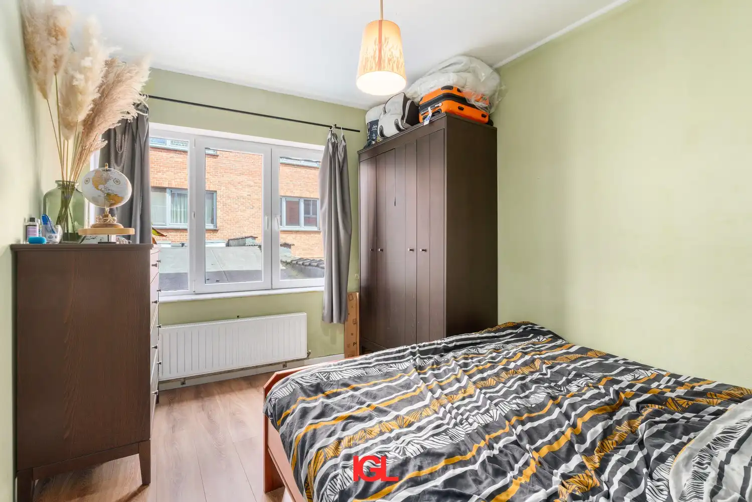 Gerenoveerd gelijkvloers appartement met 2 slaapkamers en garage. foto 9
