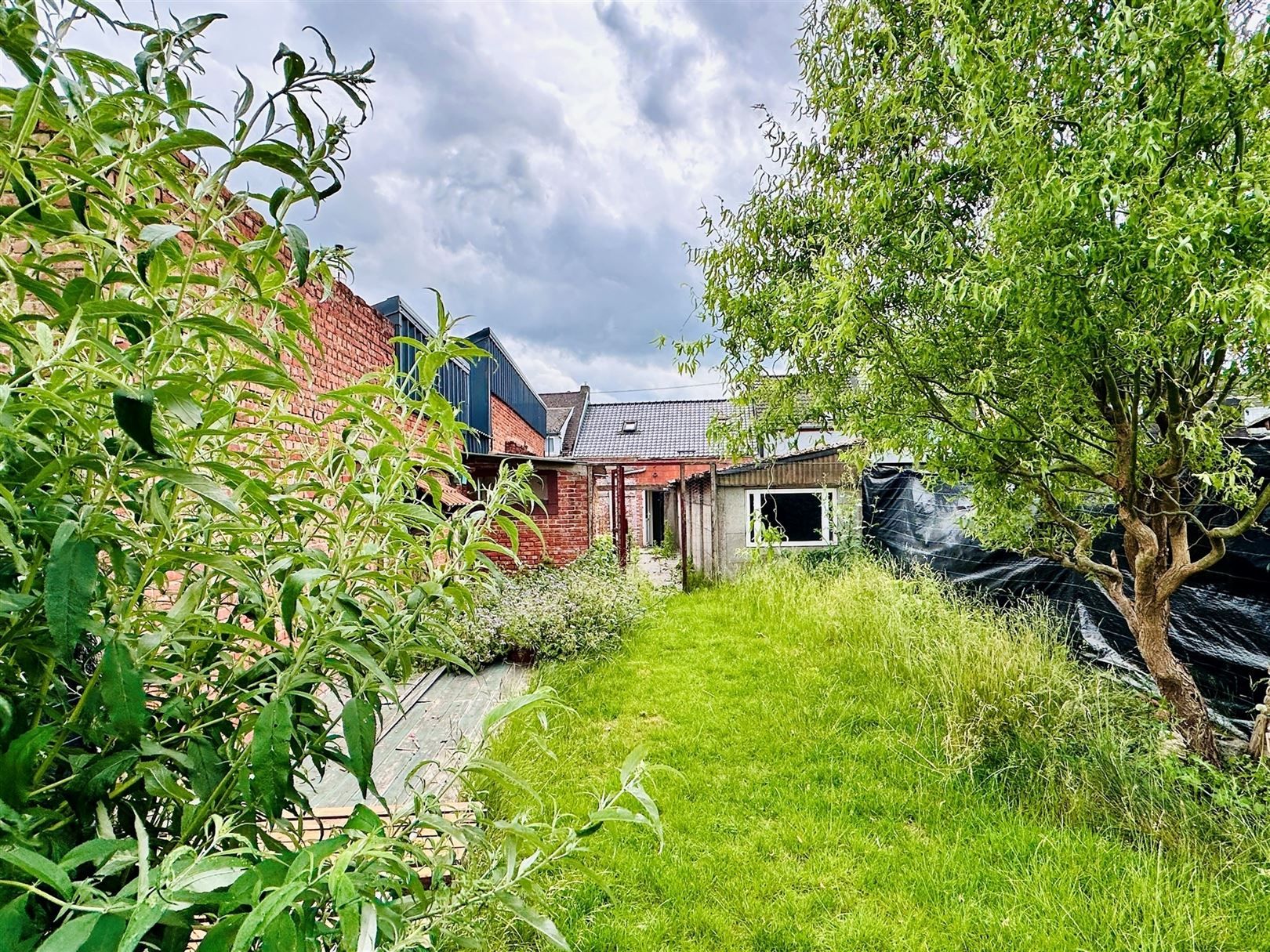 Ruime woning met diepe tuin in Grembergen met mogelijkheid tot handel of zelfstandige activiteit foto 21