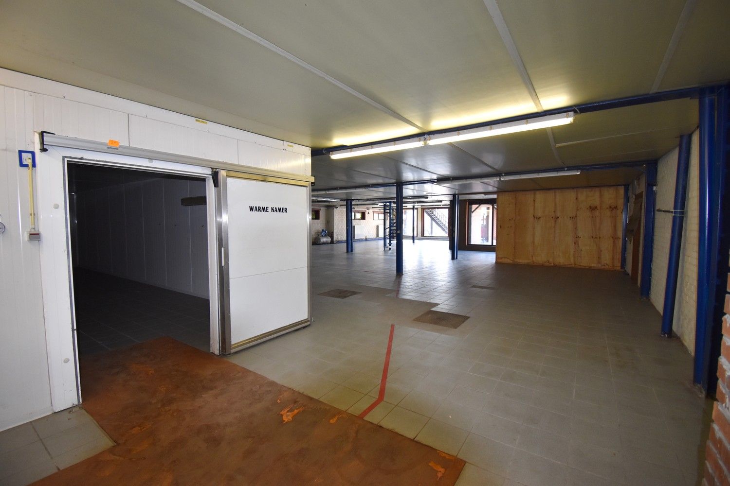 Polyvalent gebouw bestaande uit winkelruimte, appartement en loods foto 20