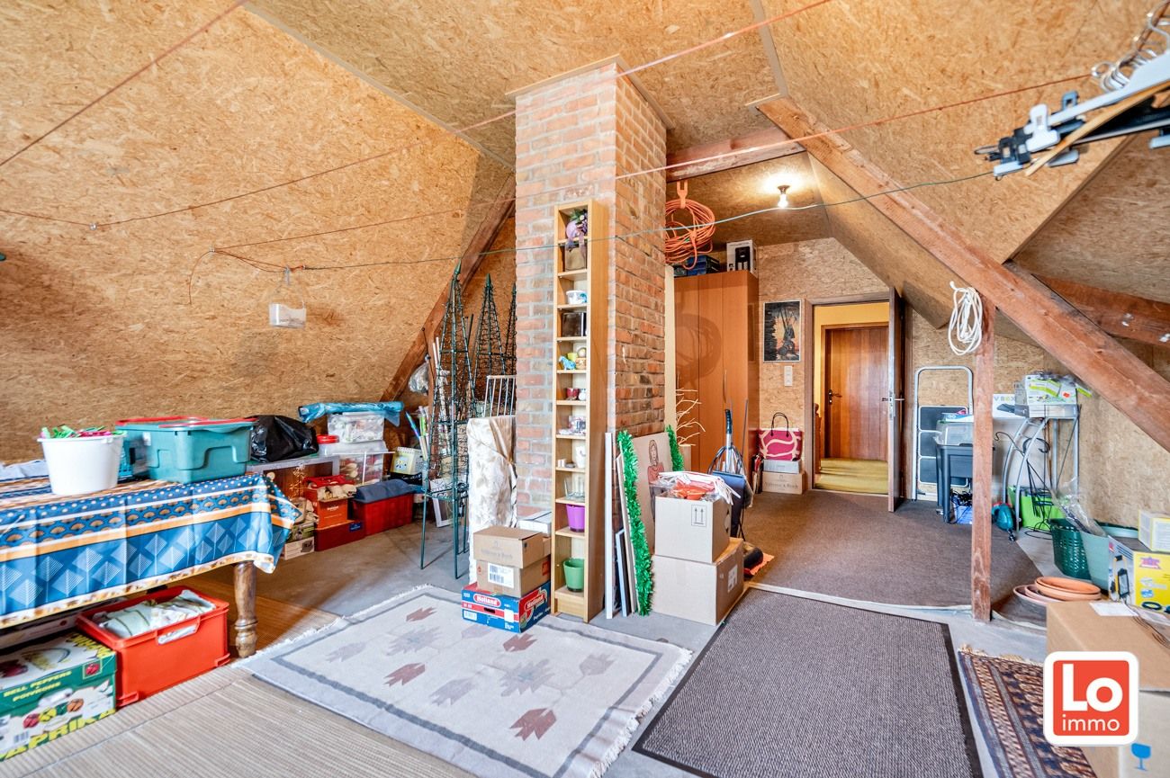 Degelijke alleenstaande woning met inpandige garage gelegen op een strategische locatie vlakbij Beervelde Dorp en het Park van Beervelde! foto 12