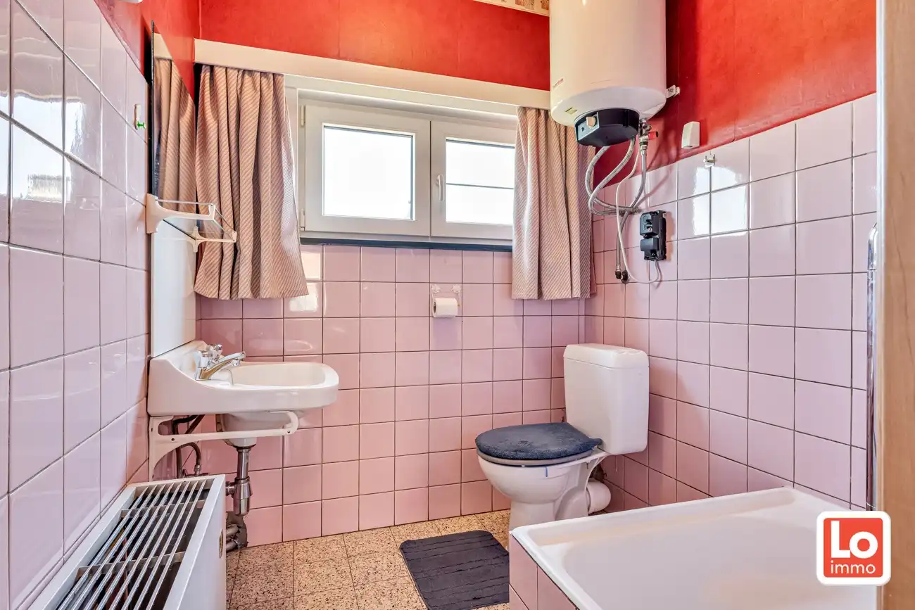 Verder te renoveren halfopen woning en afzonderlijke dubbele garage en stadstuin op een gemakkelijk bereikbare locatie in Hamme! foto 17