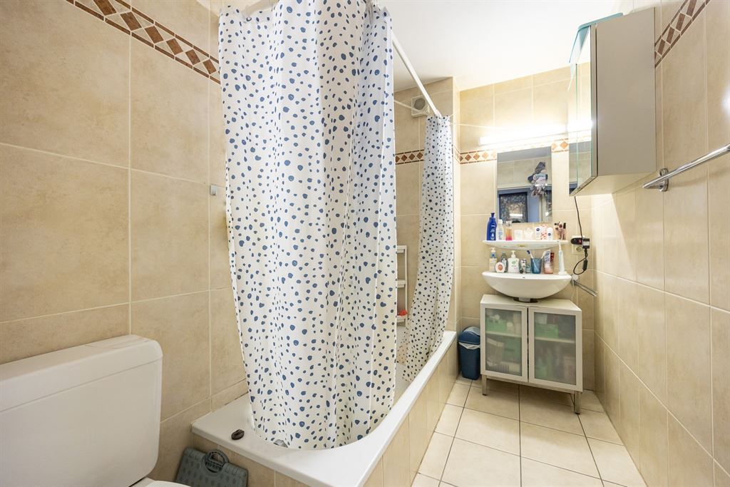 Gelijkvloers appartement met privatieve tuin! foto 11