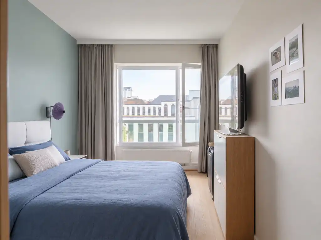 Toplocatie aan de Kouter. Wonen aan het water in een aangenaam appartement met terras. foto 10