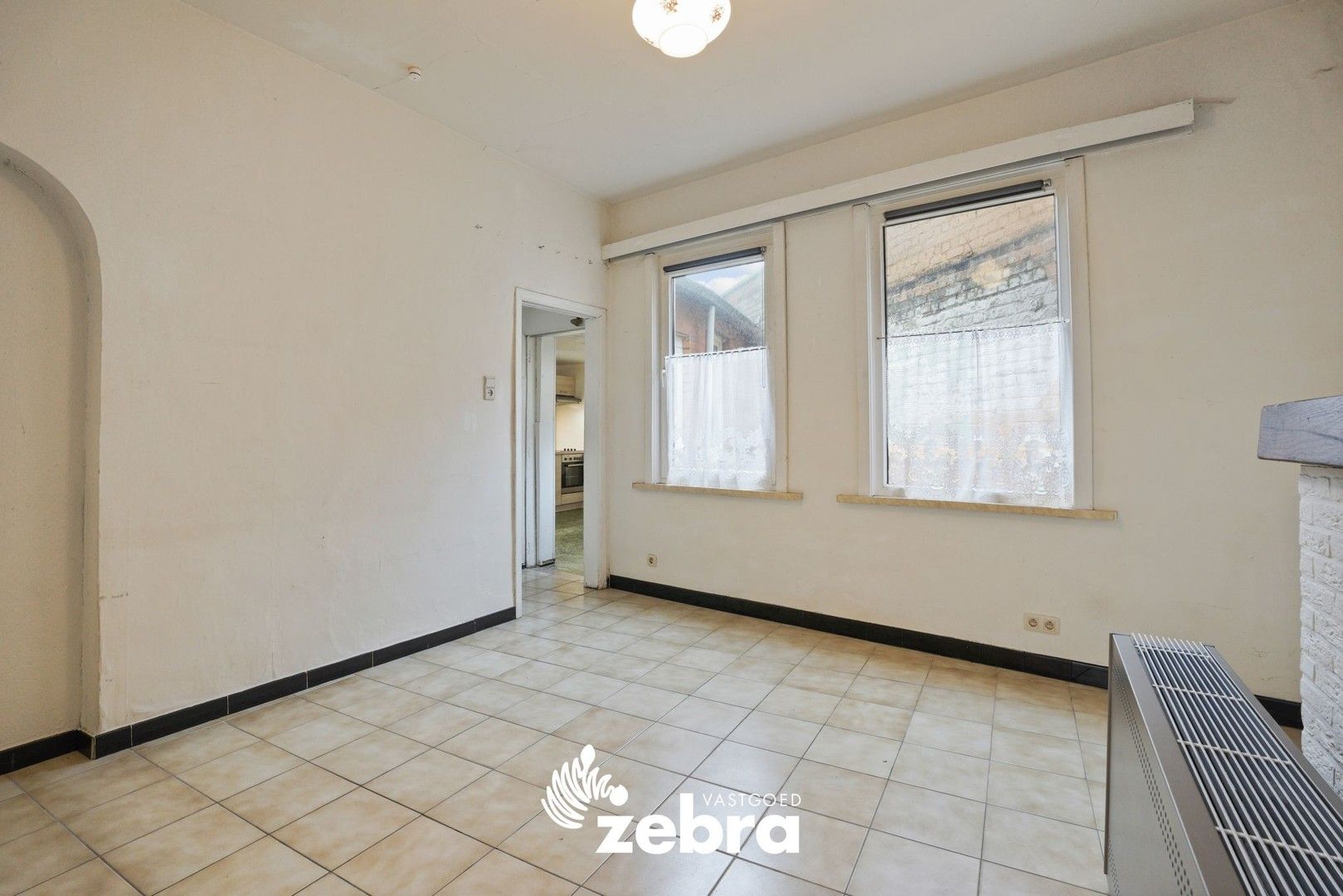 Deels gerenoveerde woning met twee slaapkamers te centrum Tielt! foto 8