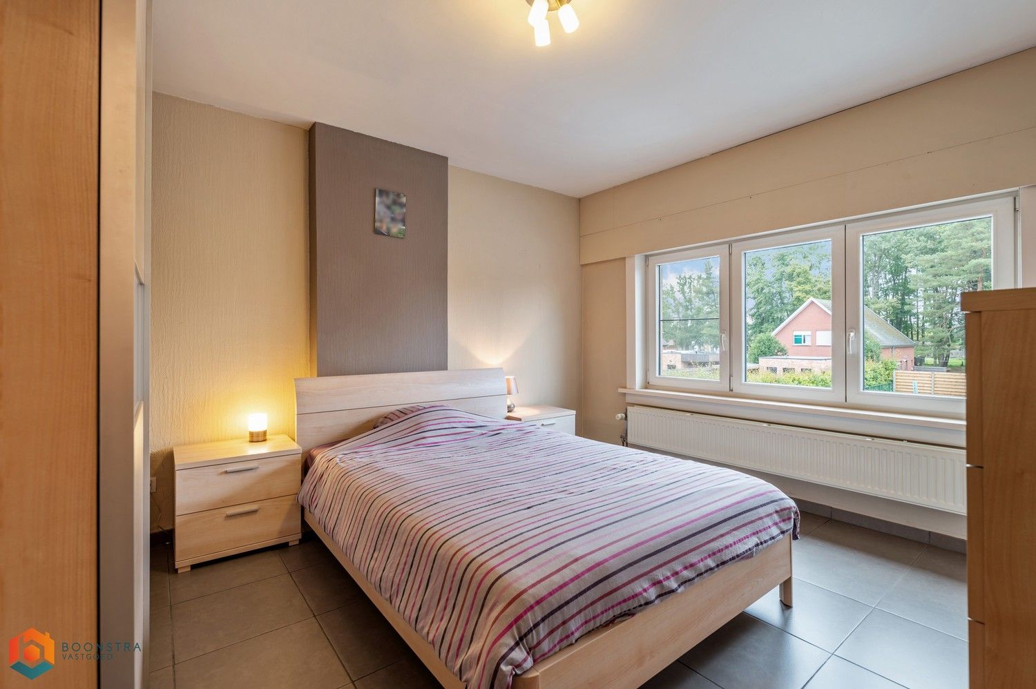 Verzorgde woning met 2 slpkrs, leuke tuin en garage foto 17