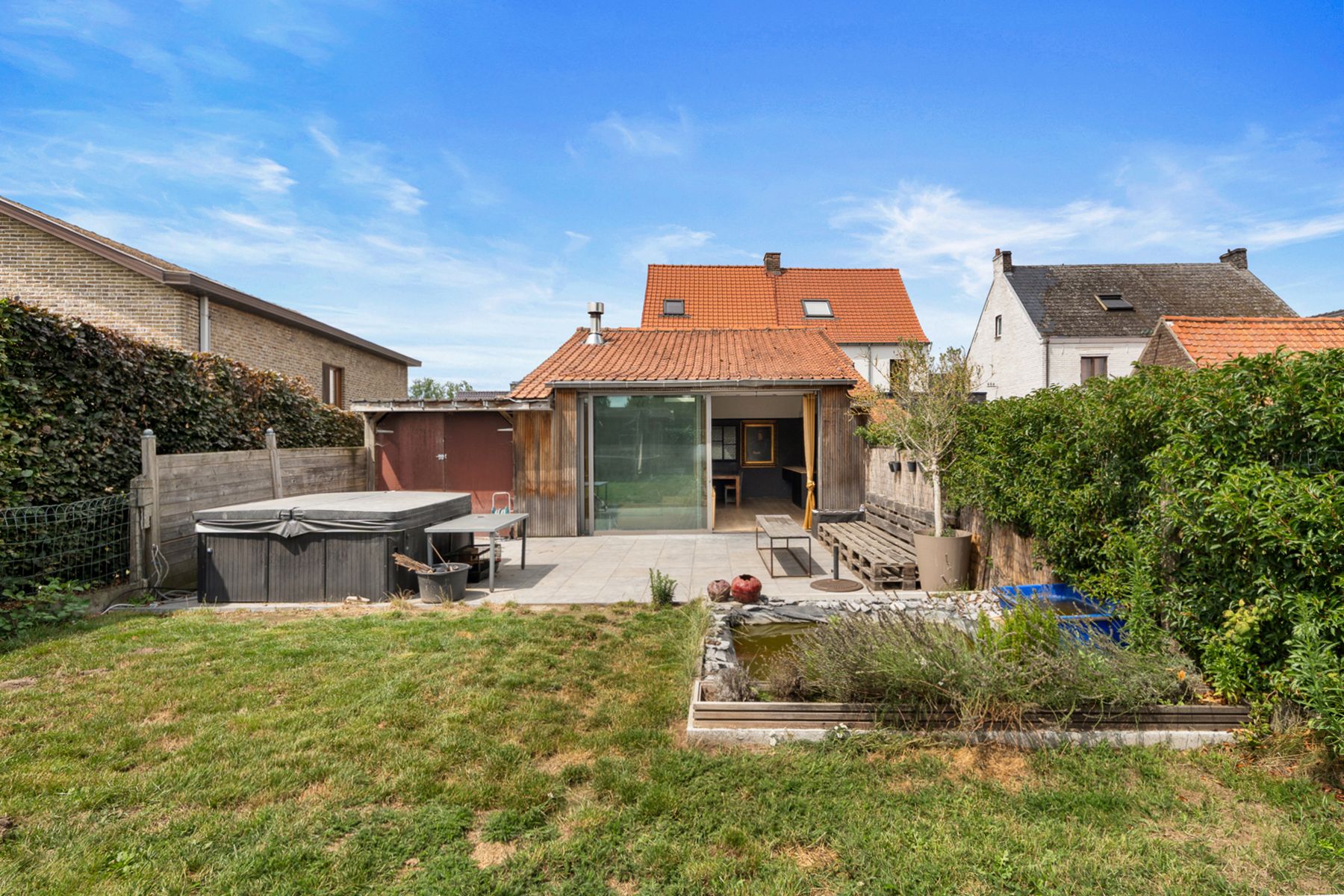 Instapklare halfopen woning met ZO-tuin én garage in Melsen! foto 18