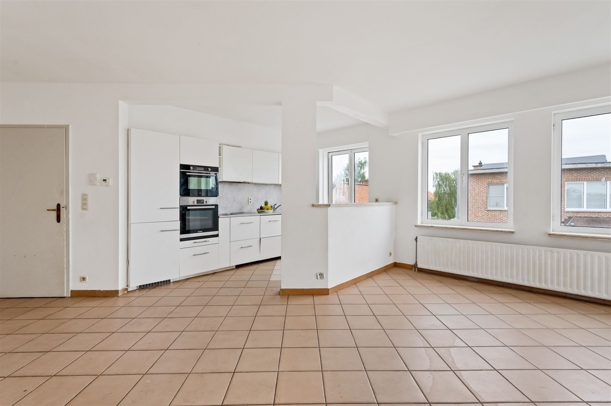 Opbrengsteigendom - 2 appartementen + handelspand te Lier foto 4