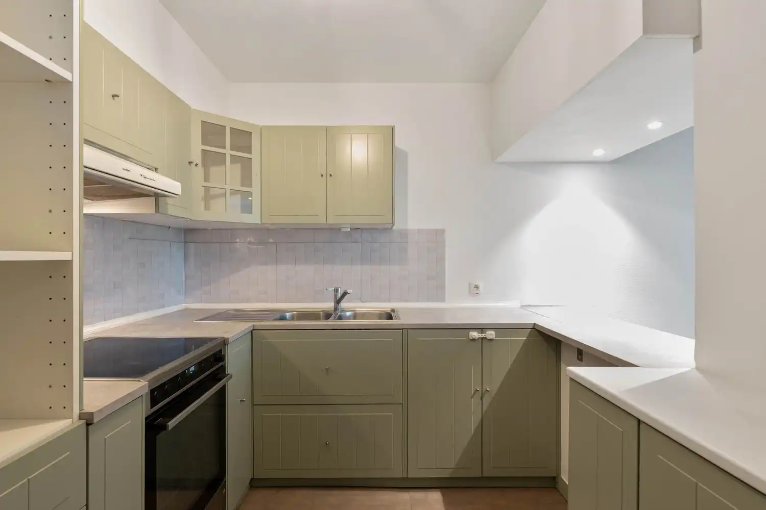 Goed gelegen, lichtrijk en energiezuinig appartement met 2 slaapkamers, een terras en een gemeenschappelijke tuin tegenover de botanische tuin en nabij het UZ Gasthuisberg te centrum Leuven! foto 11