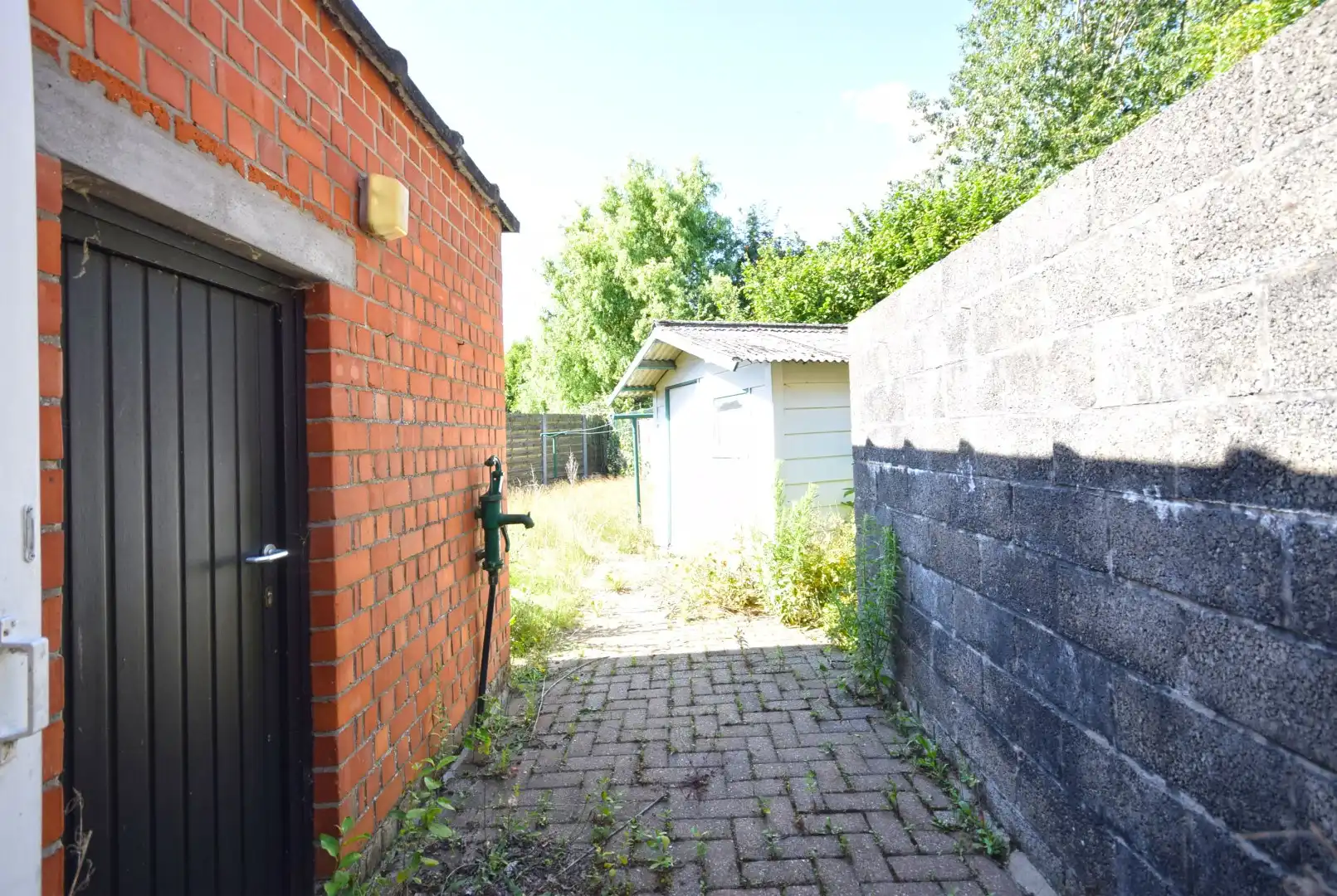 Te renoveren arbeiderswoning met tuin nabij het centrum van Roeselare foto 11