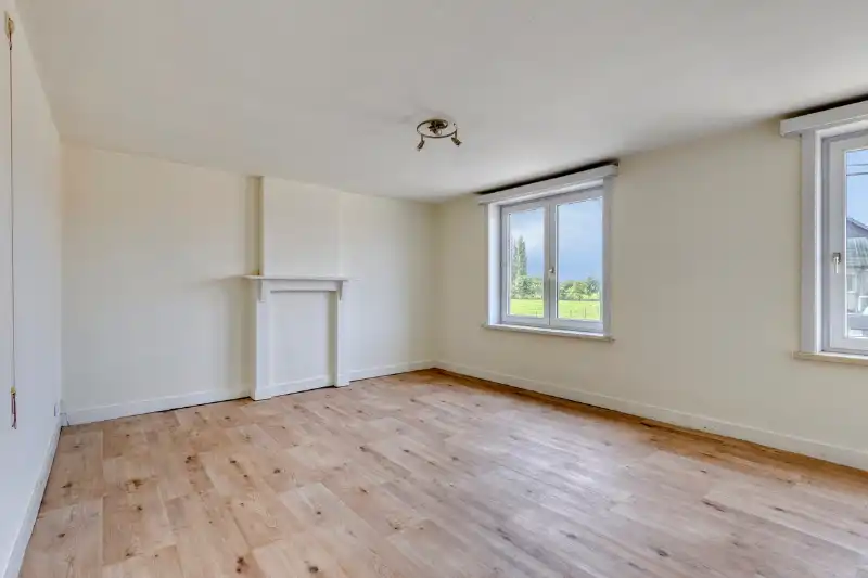 Charmante halfopen woning met authentieke elementen en prachtig zicht op de weilanden foto 12