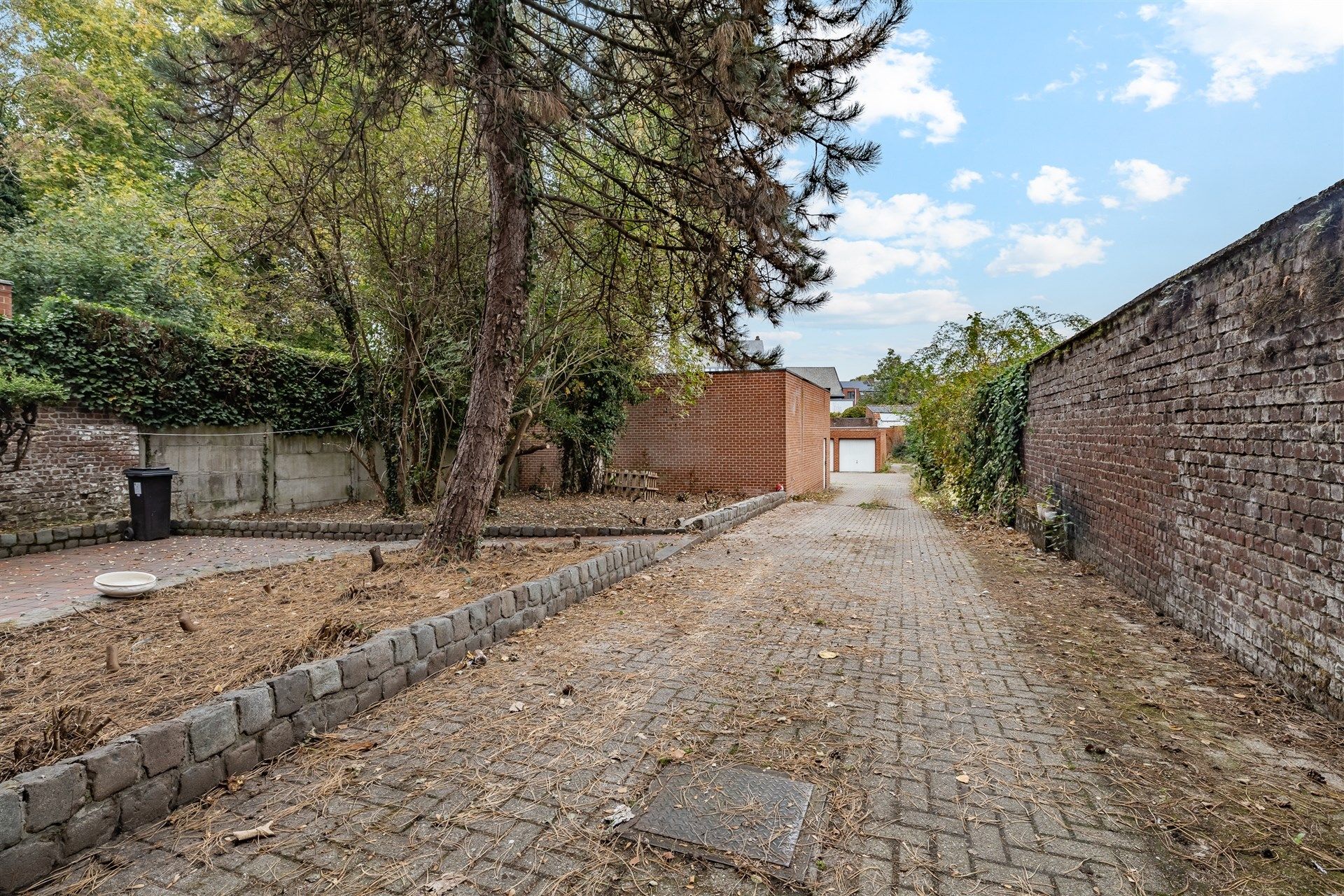 Opbrengsteigendom bestaande uit 4 appartementen + 22 garageboxen + magazijn/werkplaats foto 19