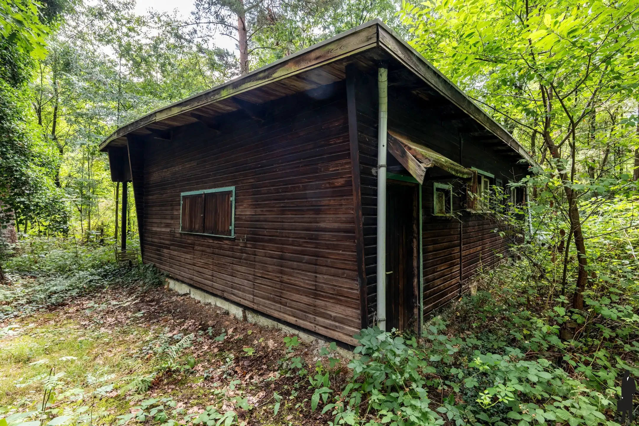 Bouwgrond met af te breken chalet foto 6