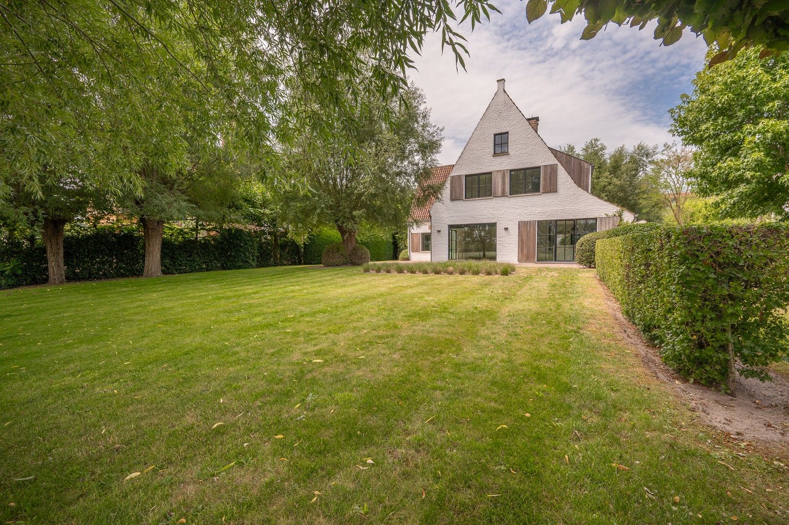 Alleenstaande villa genietend van prachtige open zichten op de polders. foto 6