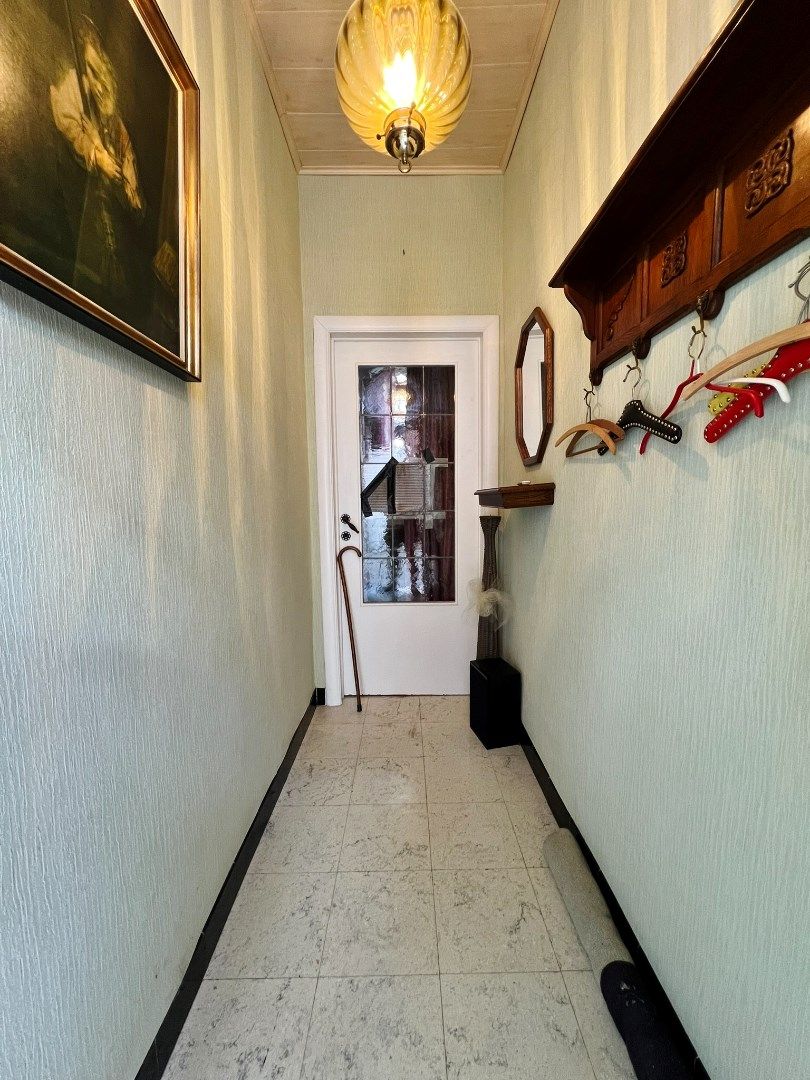 Twee te renoveren woningen met tuintje in de stadskern van Ieper foto 5