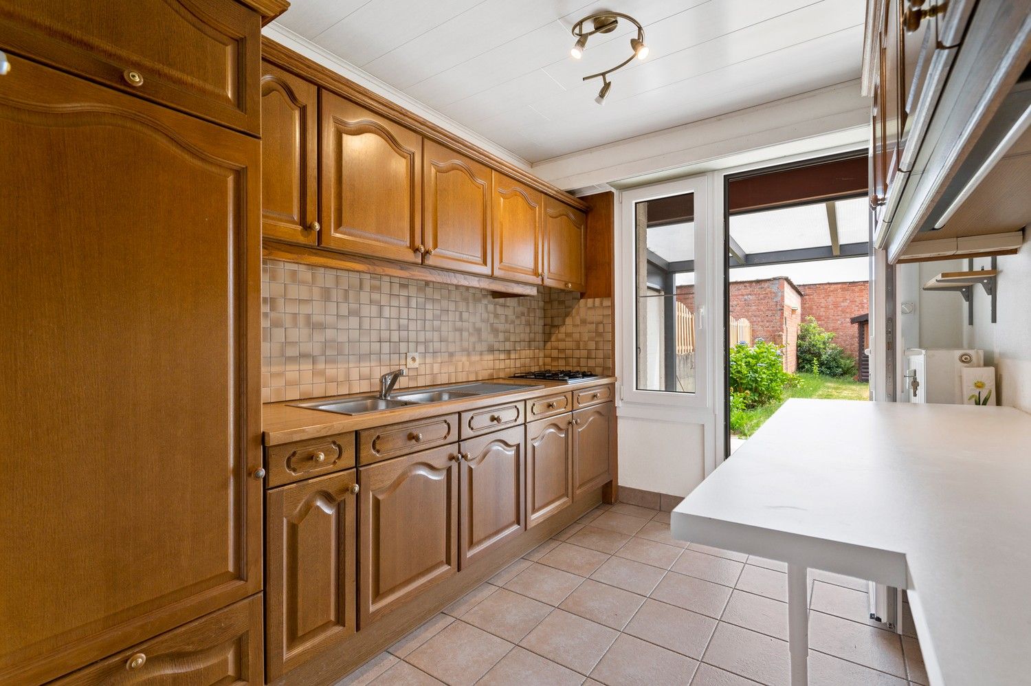 Gelijkvloers appartement met grote tuin in Deurne foto 8