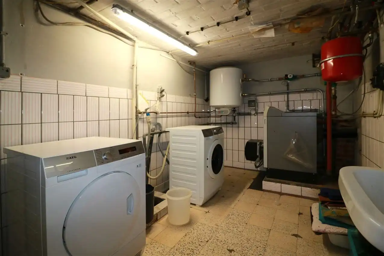 Gusting gelegen woning met 2 slpk, garage en tuin foto 25