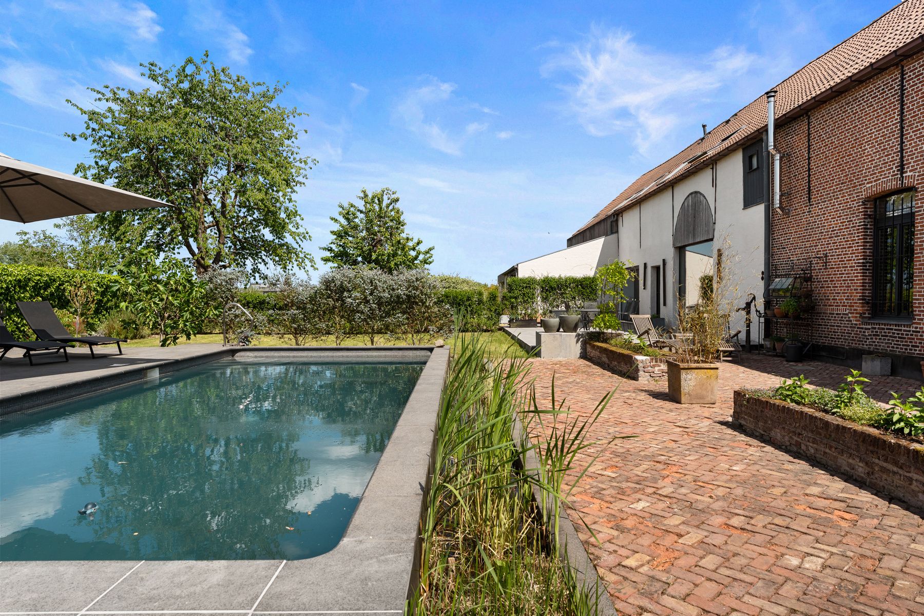 Unieke, op maat gemaakte luxe woning in gerenoveerde hoeve foto {{pictureIndex}}