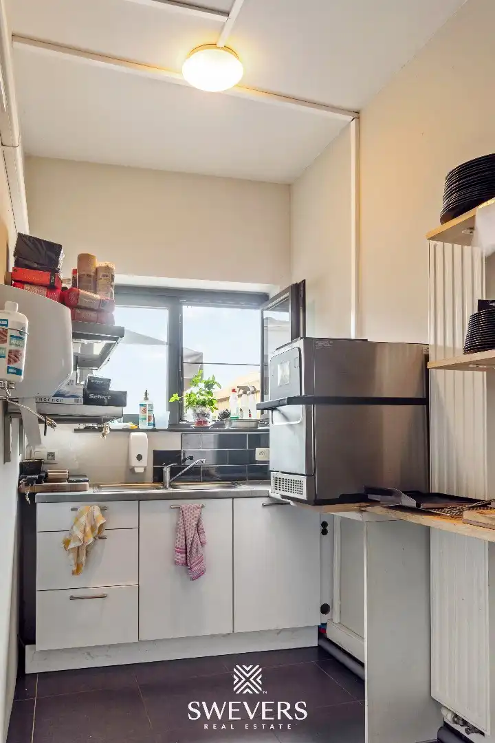 Investeringspand met huurder handelsruimte in hartje Tessenderlo, 97m², plus terras, tuinzone en parkeerplaats.   foto 18