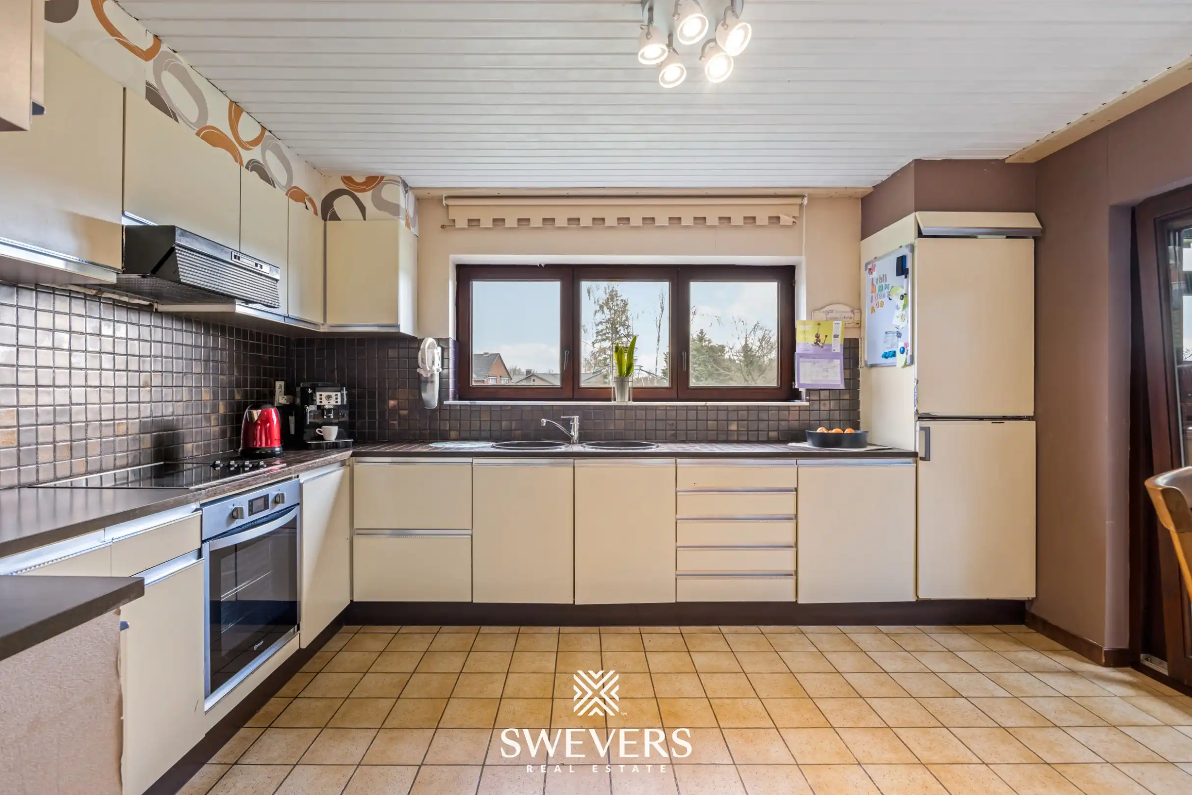 Zonnige woning met ruime zuid georiënteerde tuin in het rustige Diepenbeek foto 8