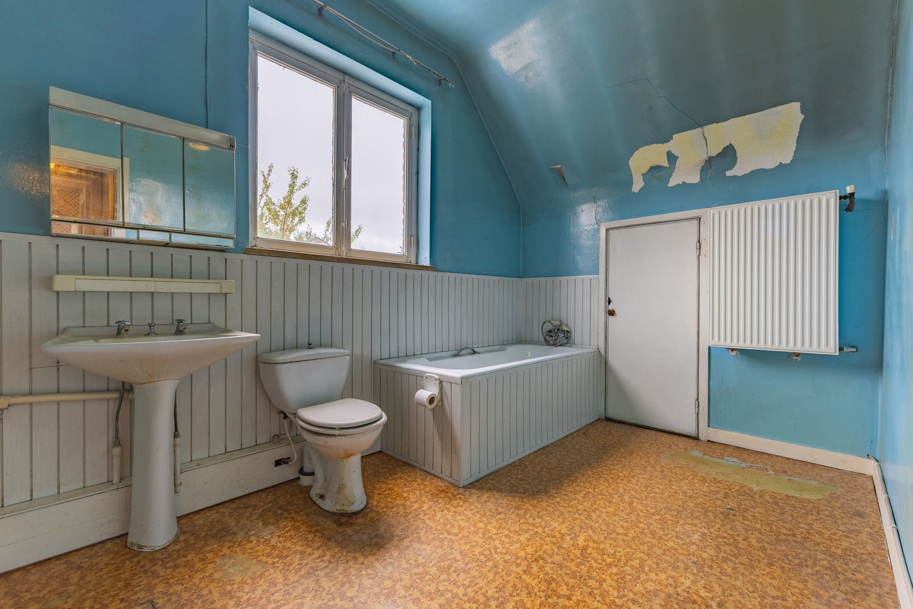Gunstig gelegen te renoveren driegevelwoning foto 19