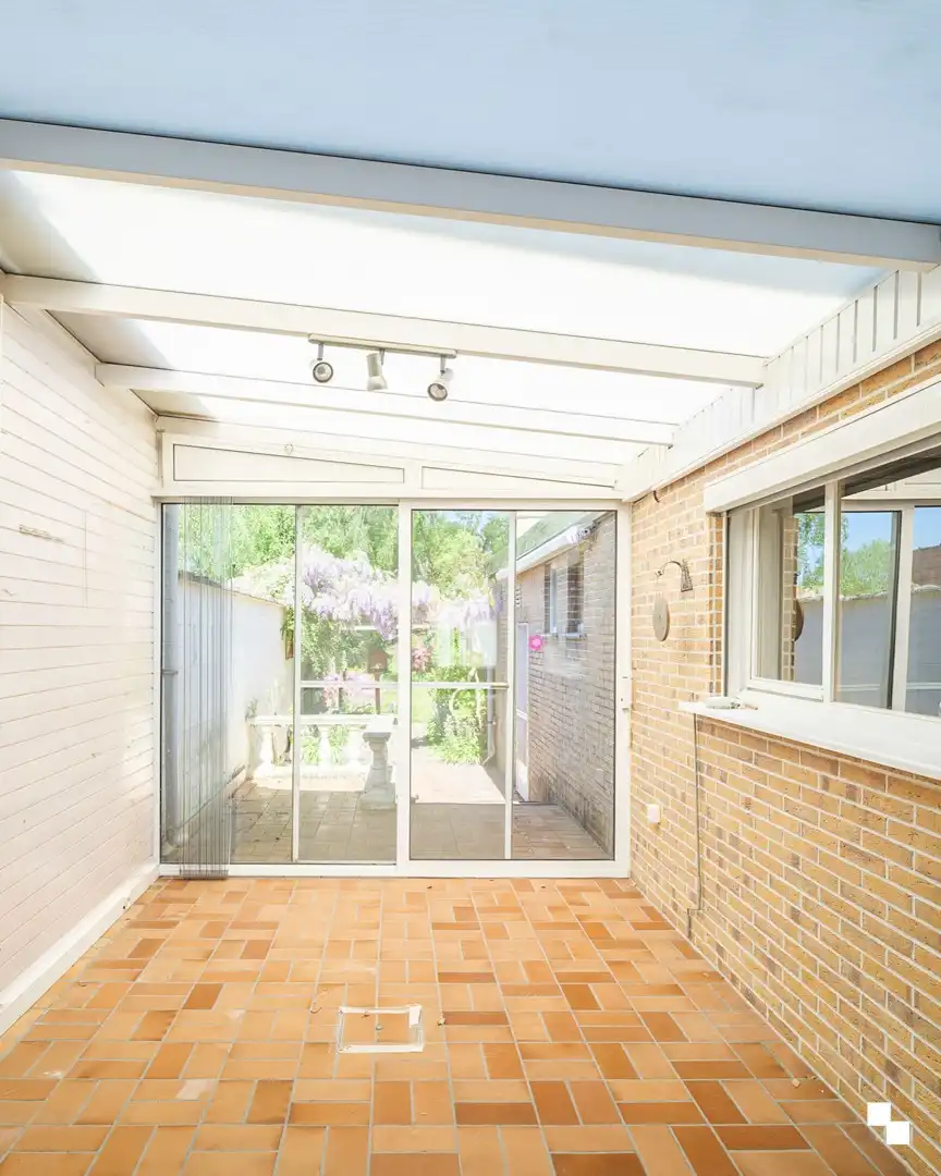 Te renoveren woning met gezellige tuin in het hart van Merelbeke foto 5