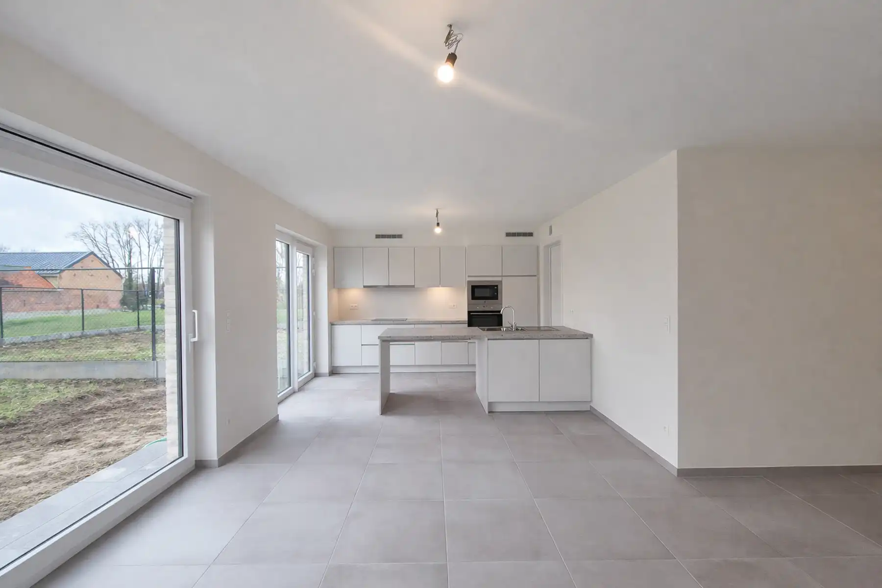 Gesloten bebouwing op de rand van Opwijk en Merchtem foto 5