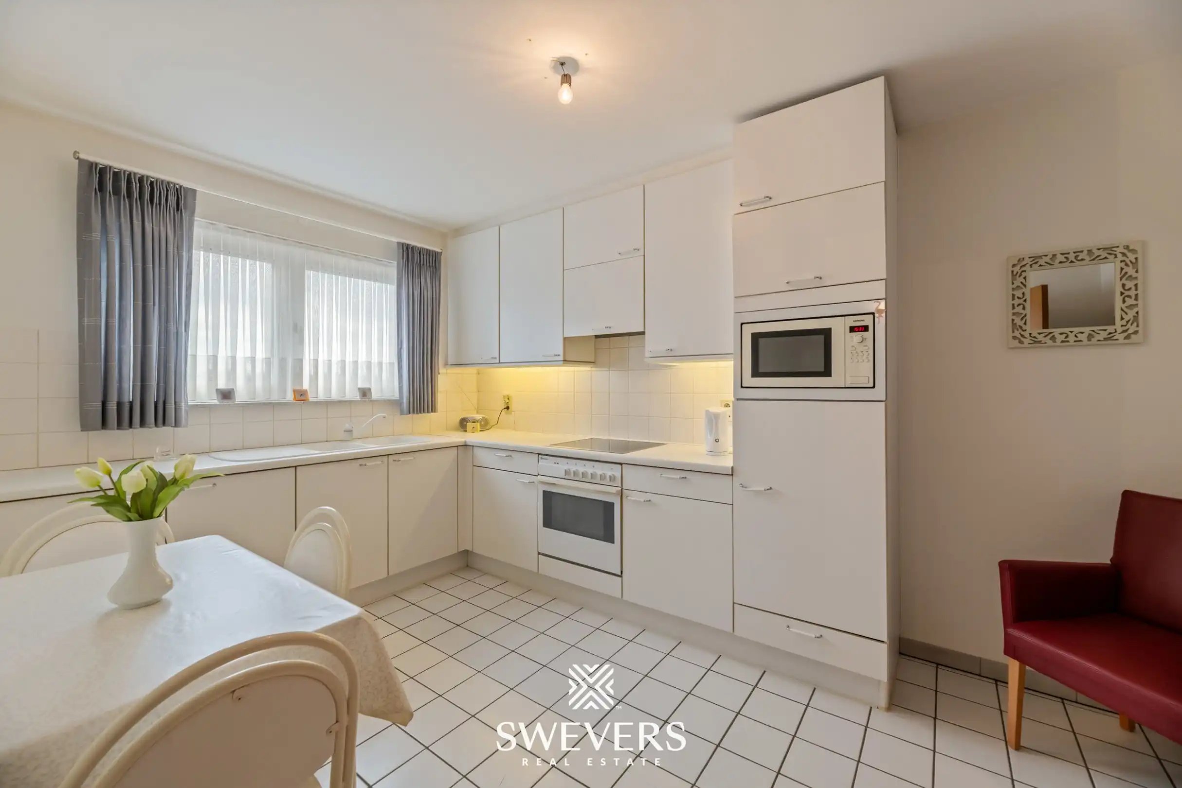 Ruim 2-slaapkamerappartement met groot terras en privéparking in centrum Beringen foto 11
