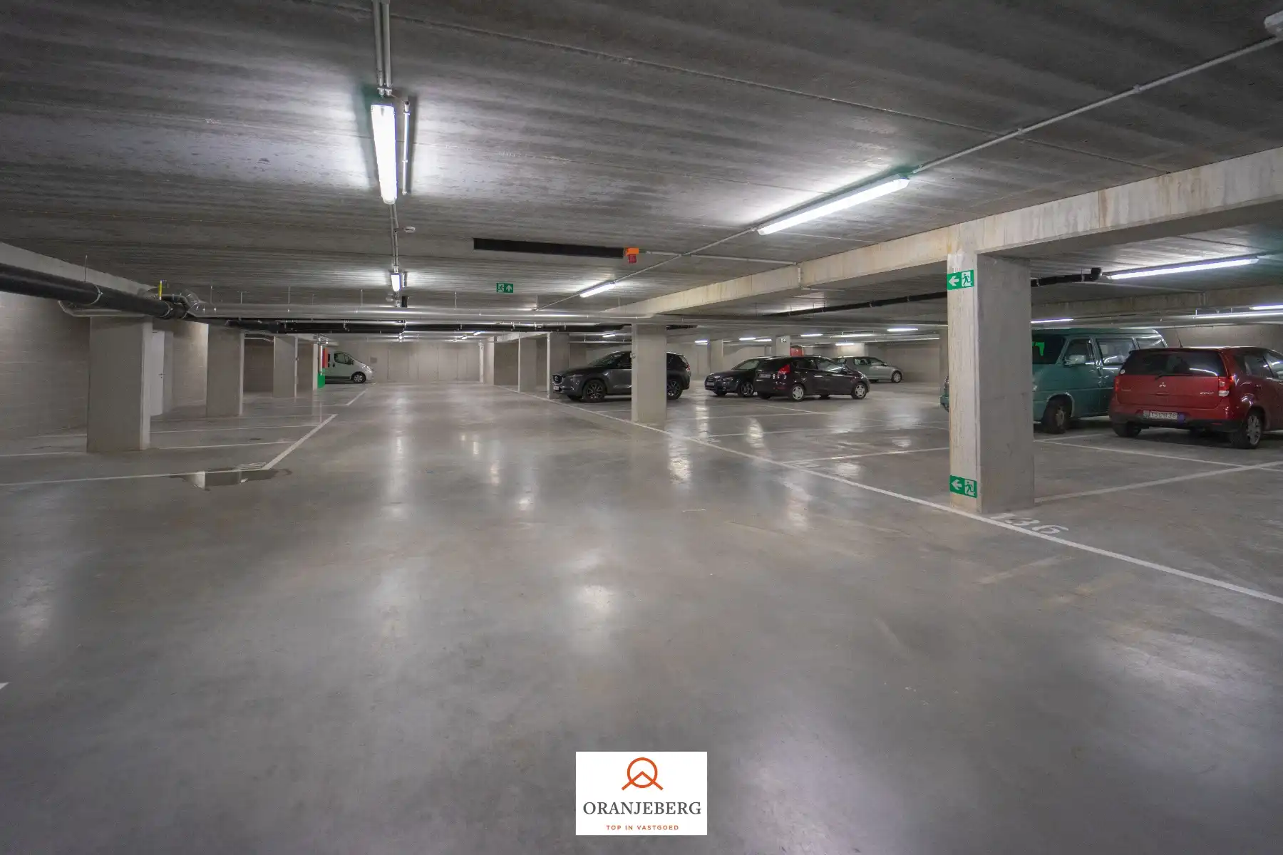 Nieuwbouw autostaanplaats te huur in afgesloten parkeergarage nabij Gent centrum foto 6