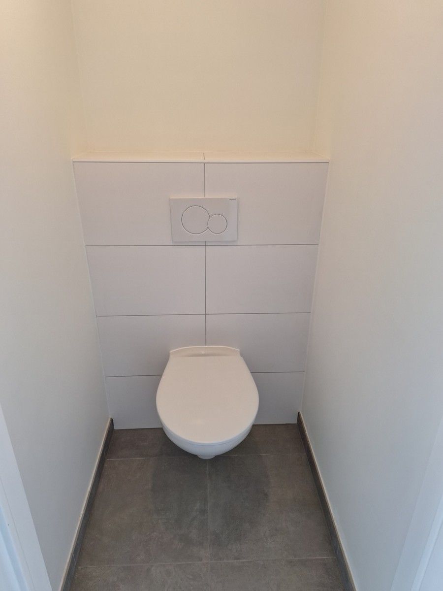 Lichtrijk gelijkvloers appartement met 1 slaapkamer, tuin, autostaanplaats en kelderberging foto 12