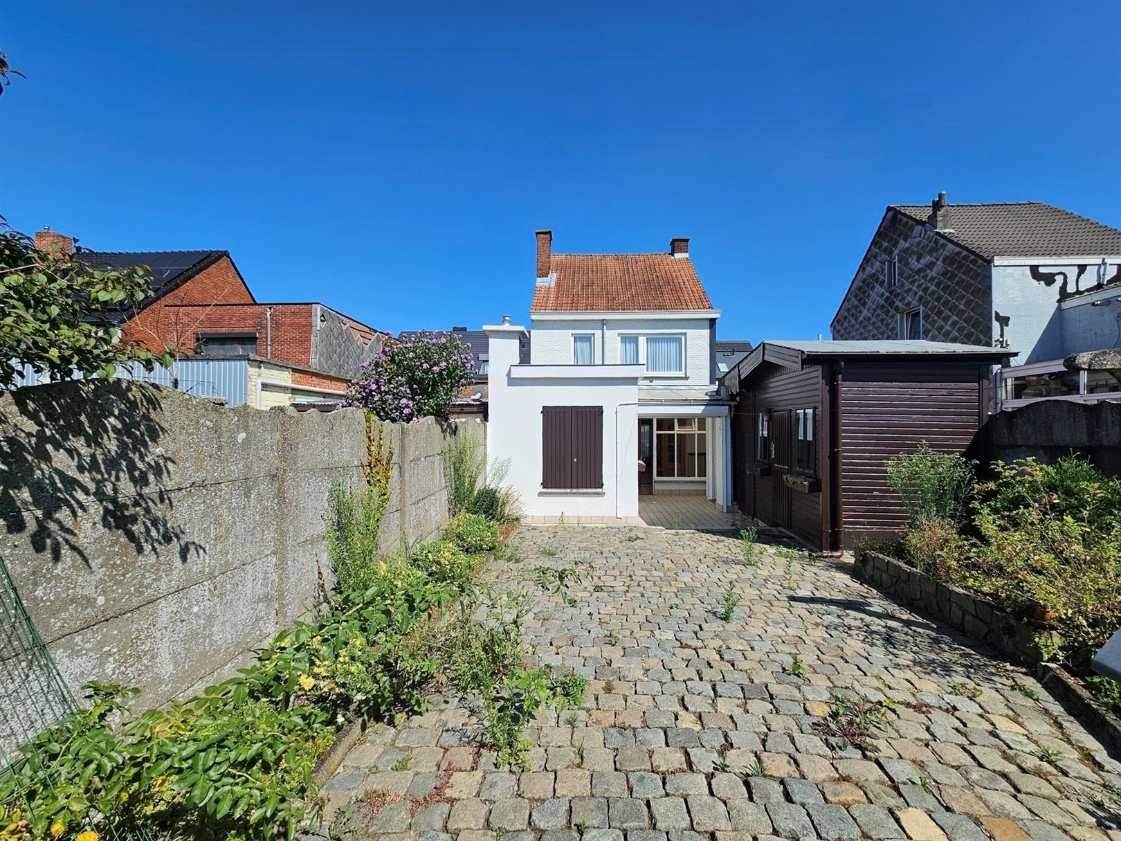 Half-open bebouwing met garage en tuin foto 14