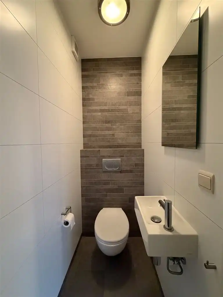 Instapklare stadswoning met 3 slaapkamers, aparte garage en tuintje. foto 14