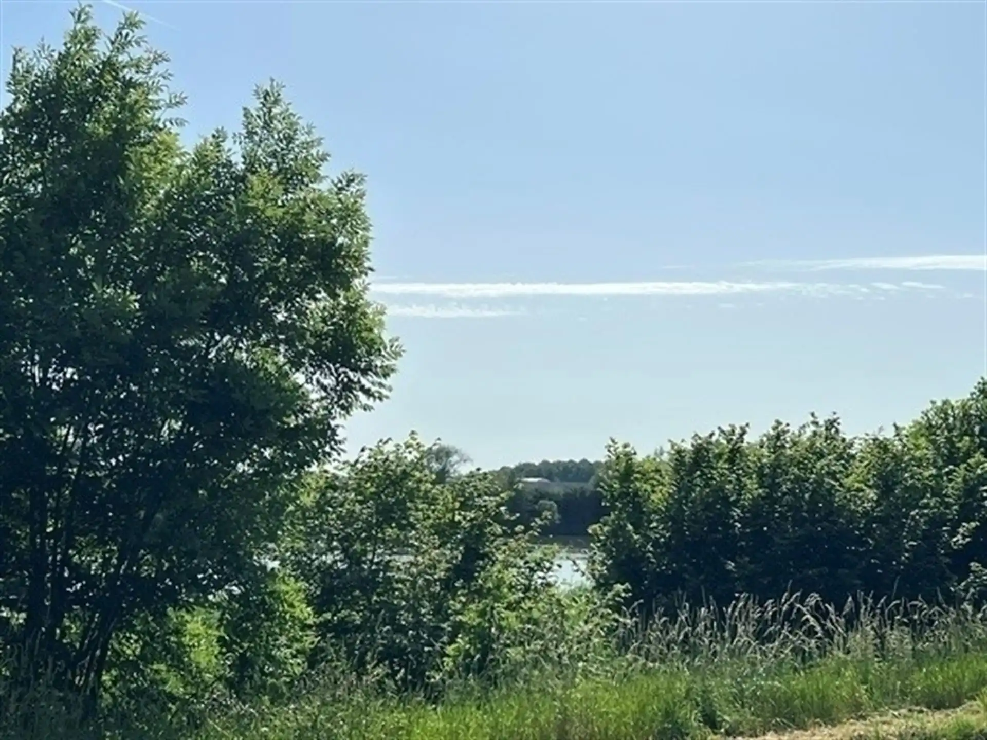 Instapklaar gelijkvloers appartement met zonnige tuin en uniek zicht op het water! foto 11