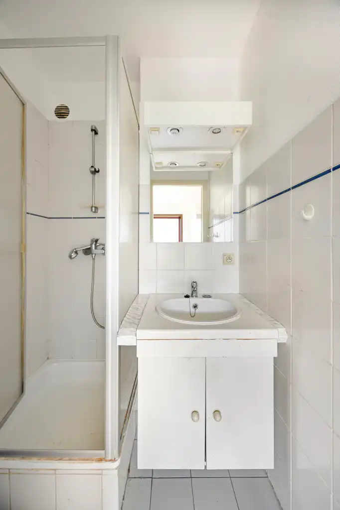 Ruim 3-slaapkamerappartement met garage op toplocatie foto 15