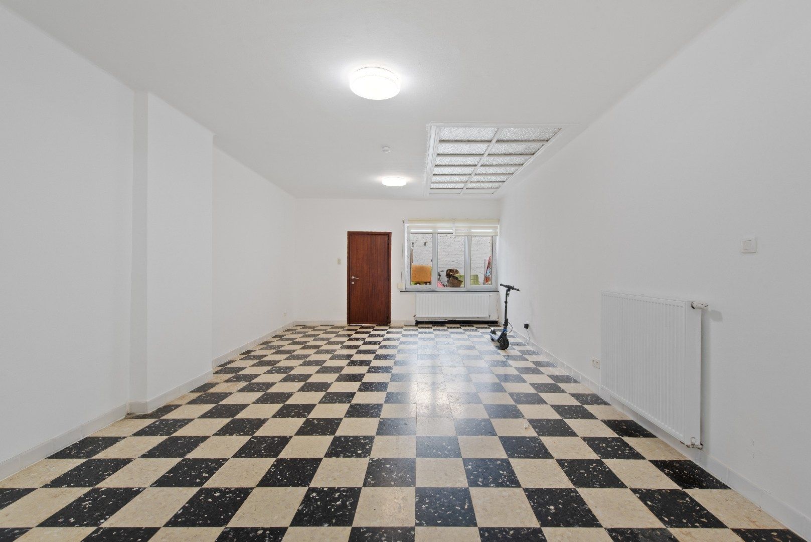 Polyvalente rijwoning met grote handelsruimte te Tienen foto 18