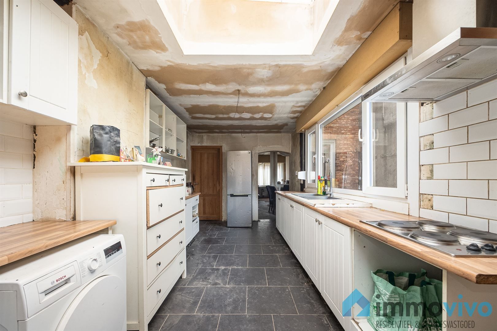 Te renoveren gezinswoning met 2/3 slaapkamers en zuidgerichte tuin. foto 5