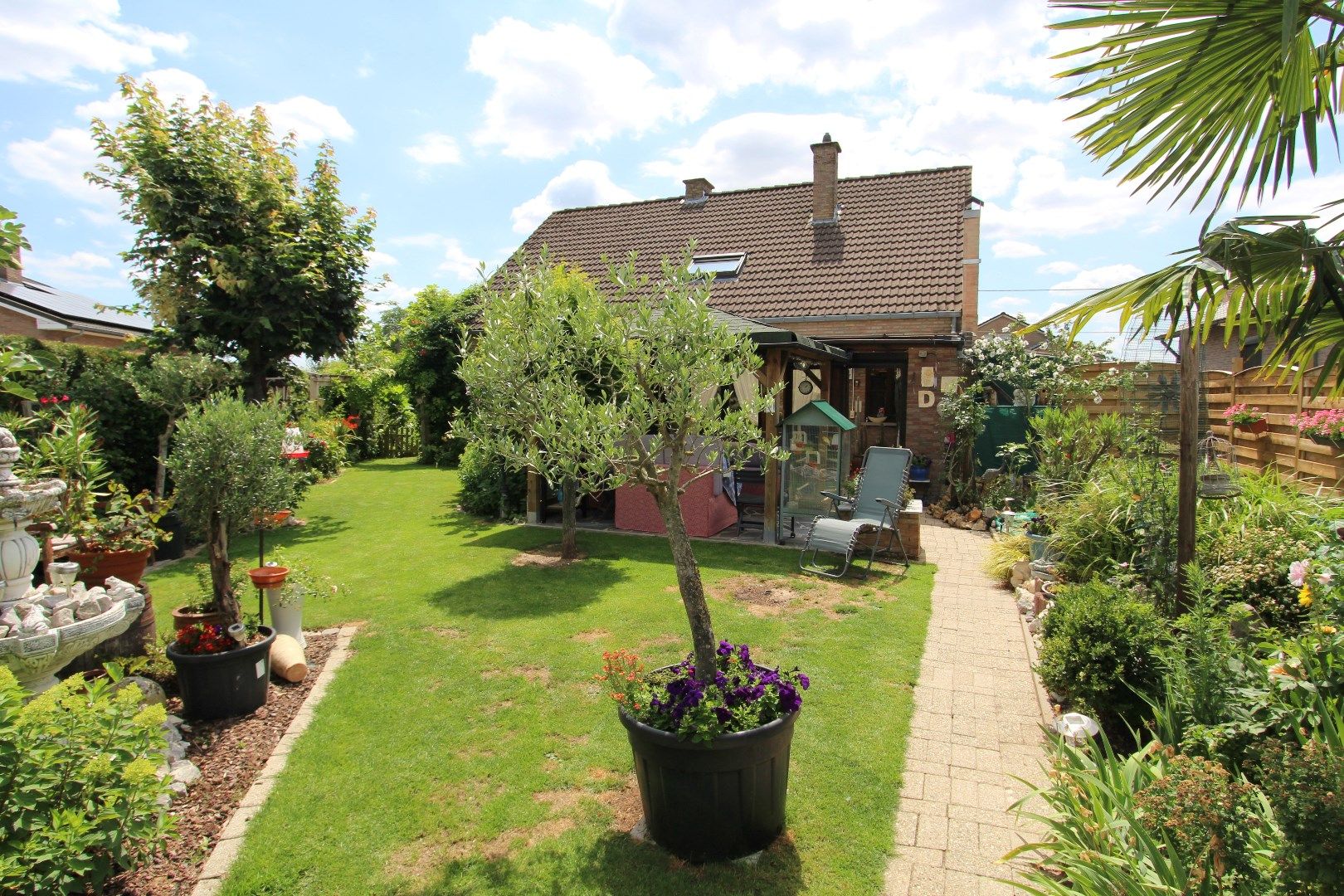 Charmante woning met veranda en mooie tuin in een rustige, landelijke omgeving foto 21
