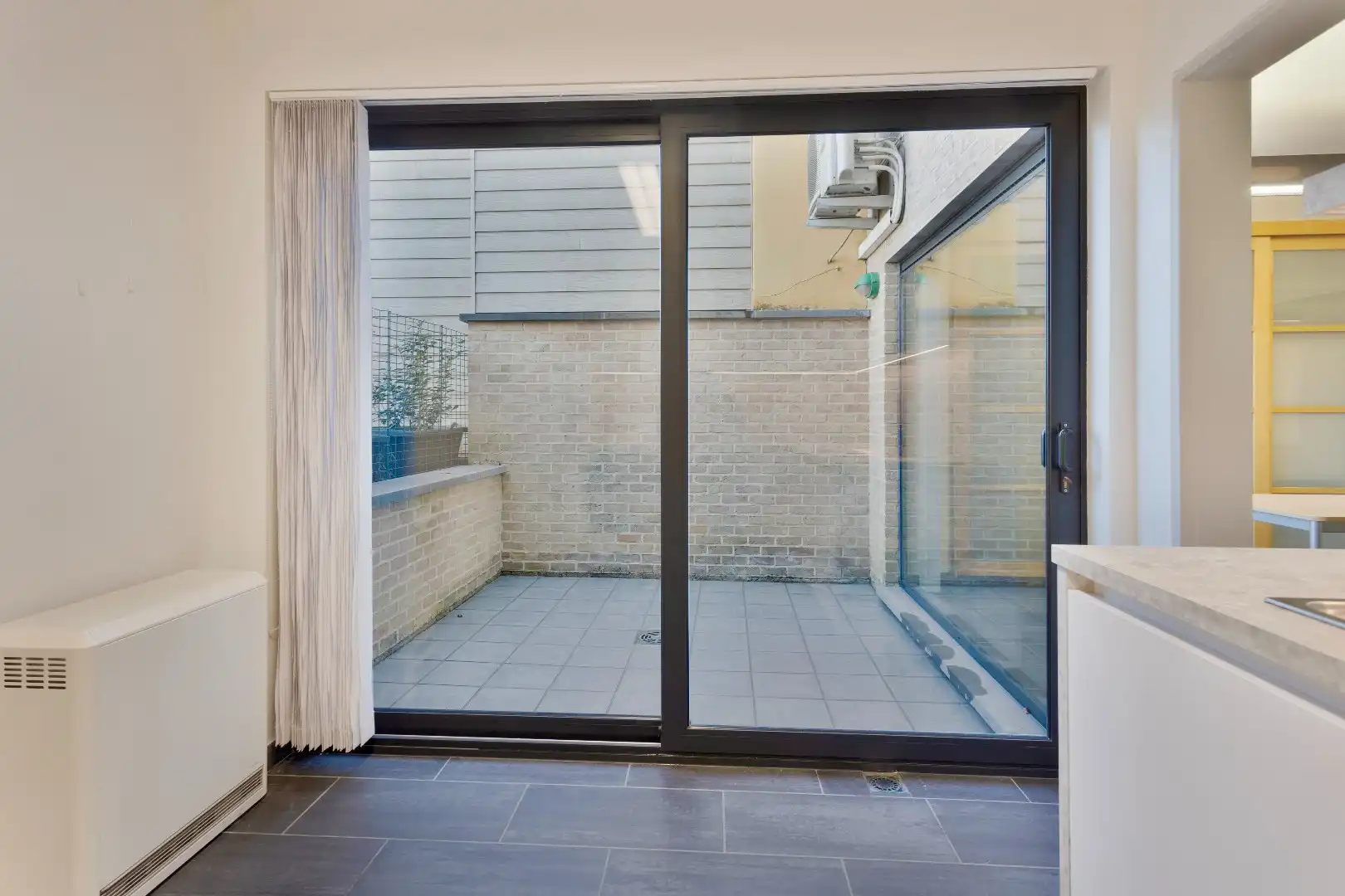 Energiezuinig en instapklaar gelijkvloersappartement met private koer foto 16