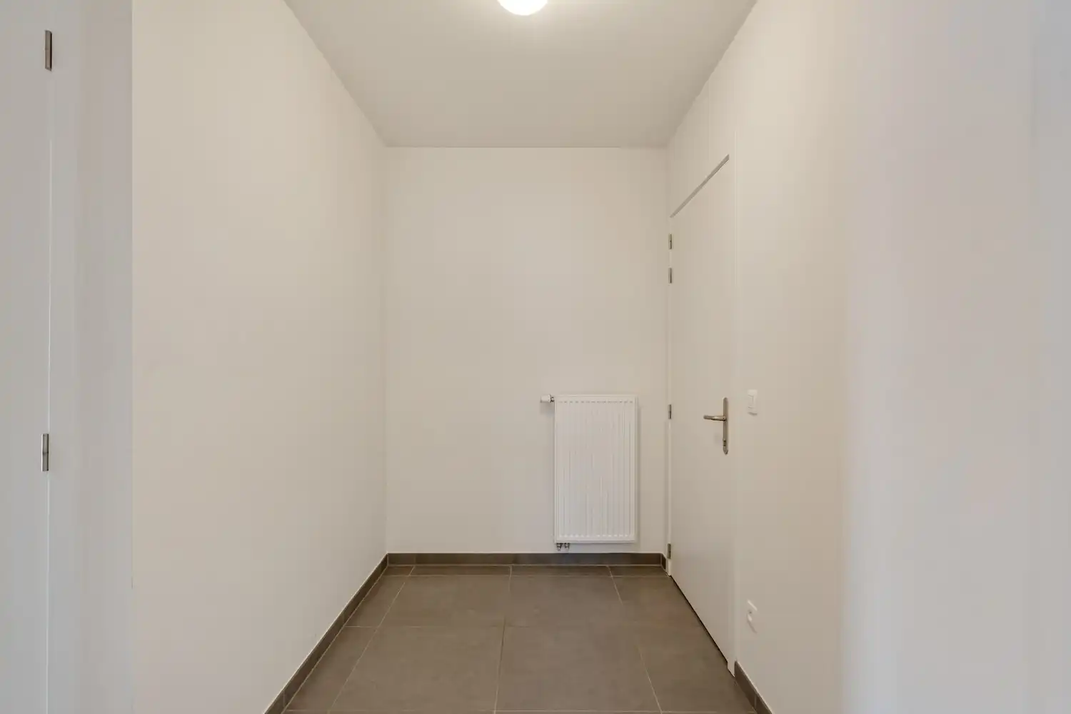 Modern en energiezuinig(A-label) dakappartement met 2 slaapkamers, 2 badkamers, een groot terras en een autostaanplaats nabij het UZ Gasthuisberg te Leuven! foto 3