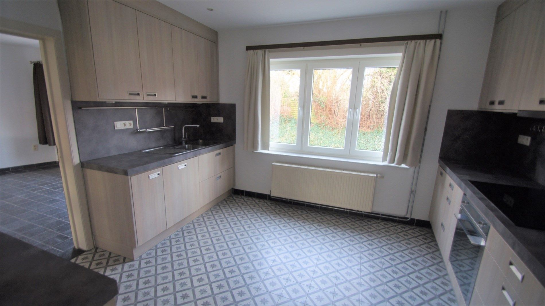 Mooi gelegen woning met tuin/terras, 2 slpks en garage foto 6