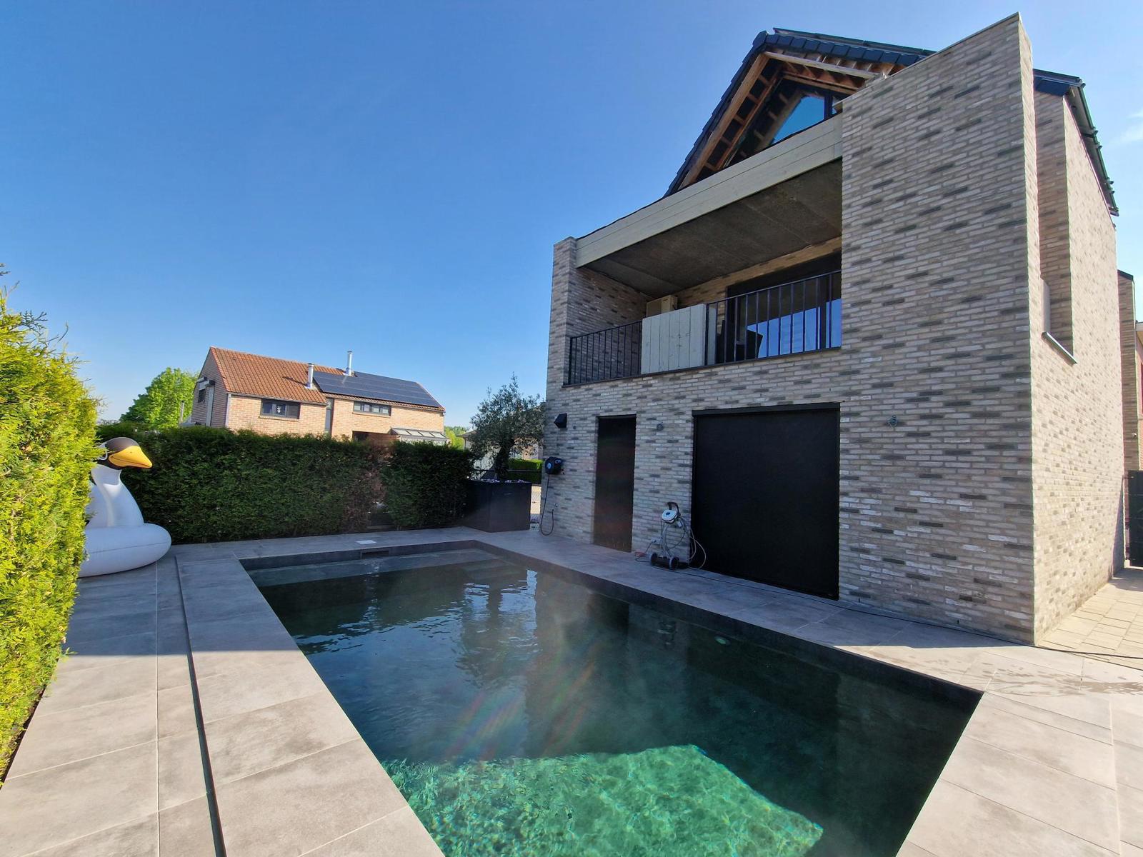 Architectenwoning met studio en zwembad te Halen foto {{pictureIndex}}
