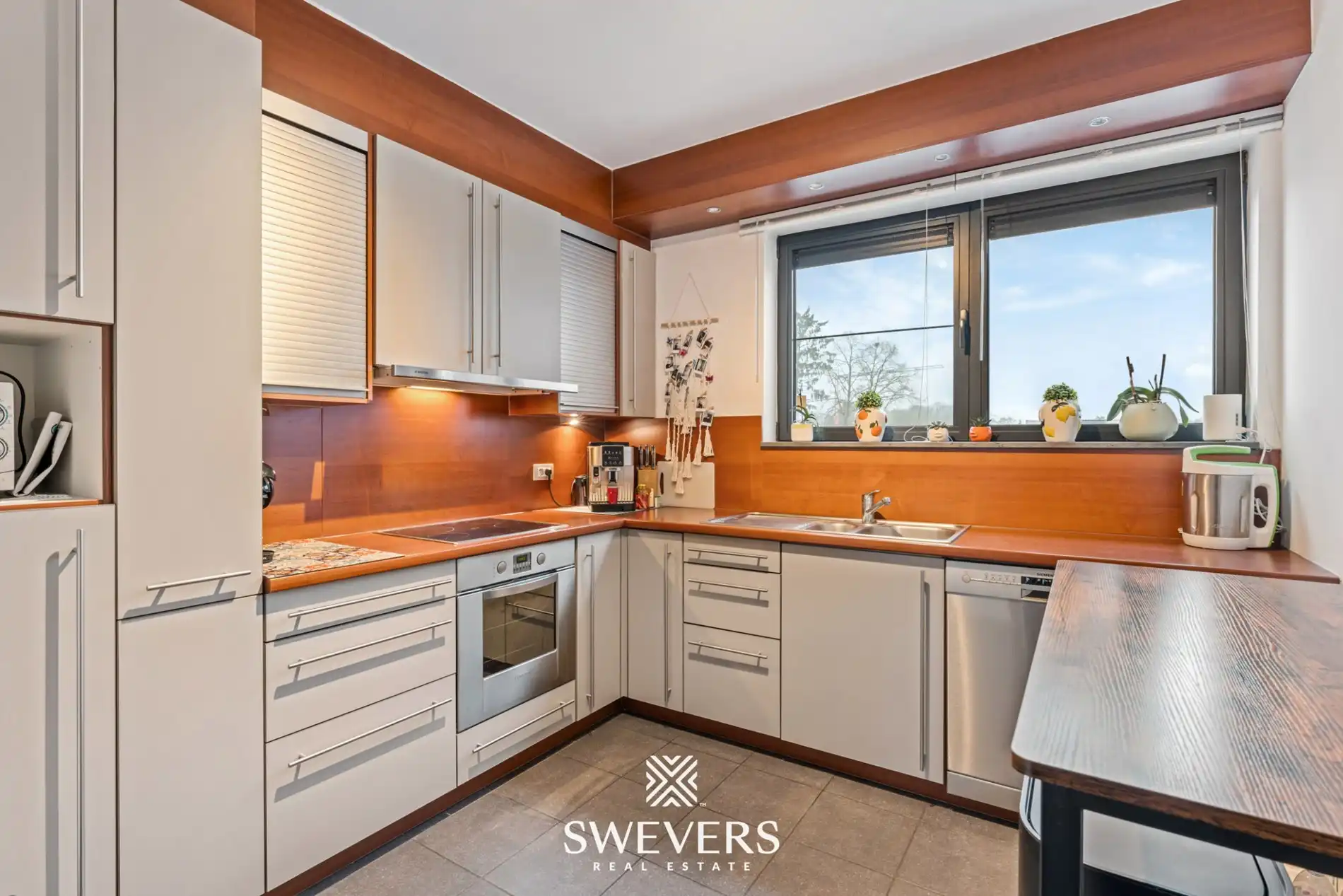 Zonnige bel-etage met dubbele garage en groot terras vlakbij het centrum van Heusden foto 12